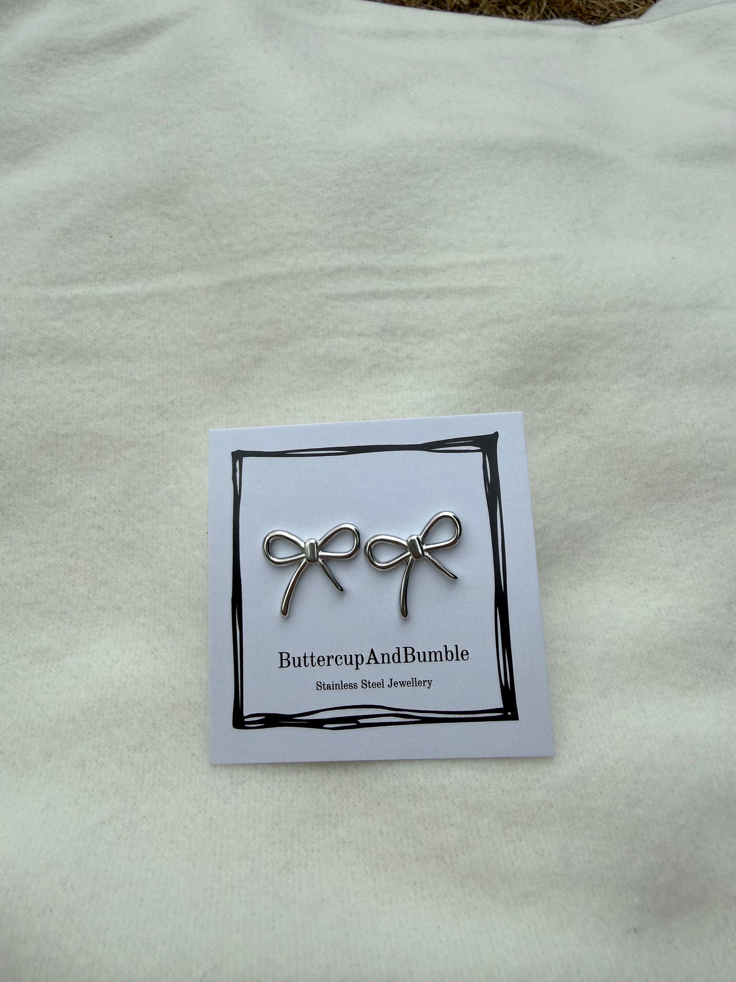 Silver dainty bow studs
