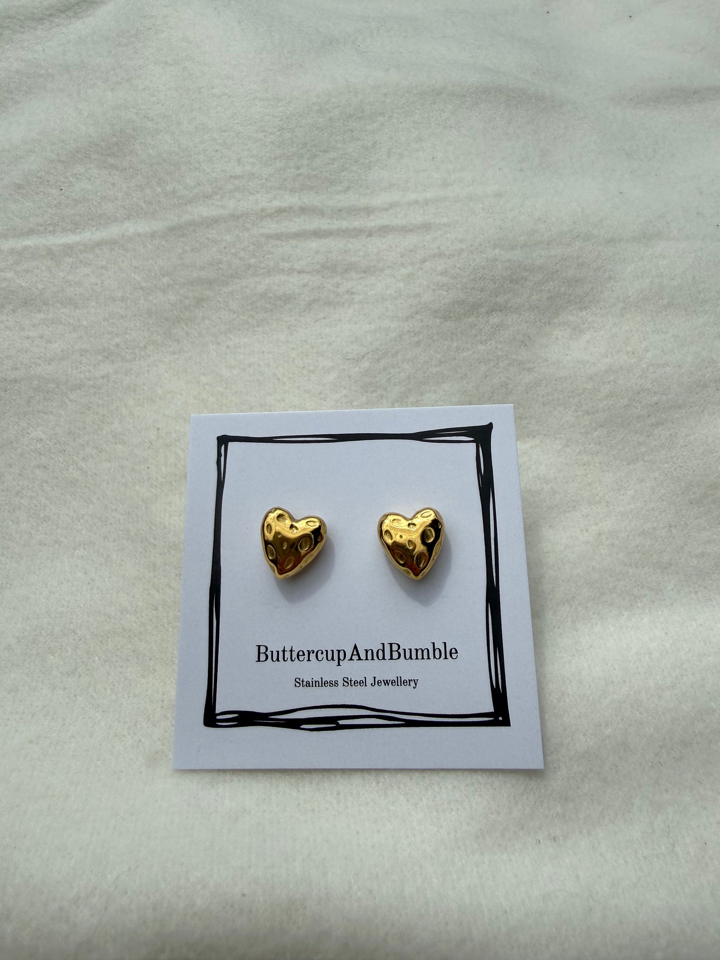Gold textured heart studs