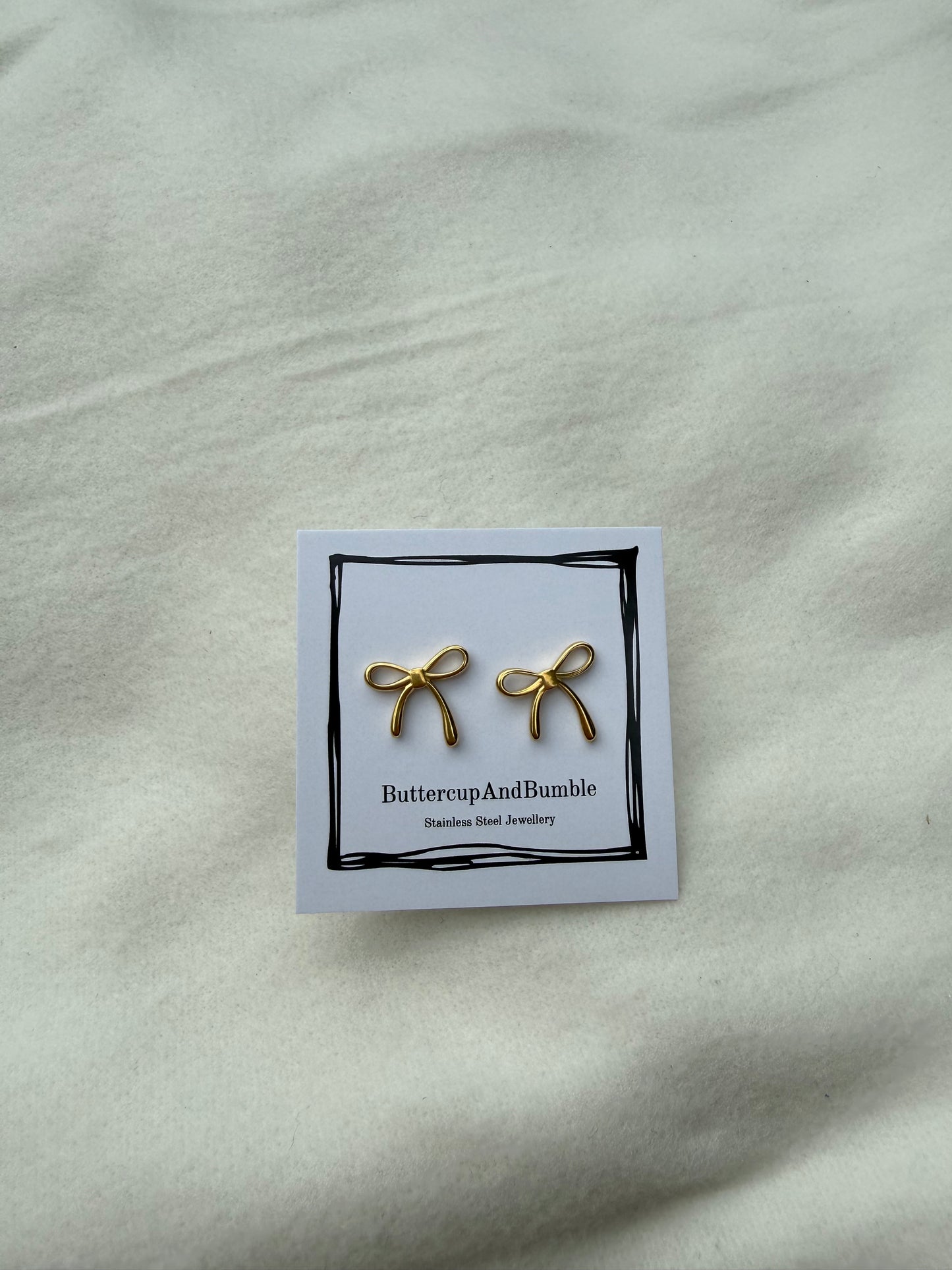 Gold dainty bow studs